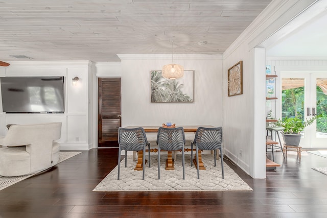 dining area featuring french doors, dark hardwood / wood-style floors, and ornamental molding