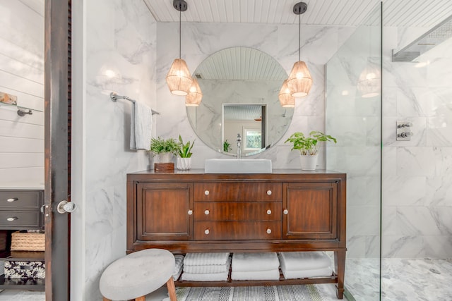 bathroom with walk in shower and sink