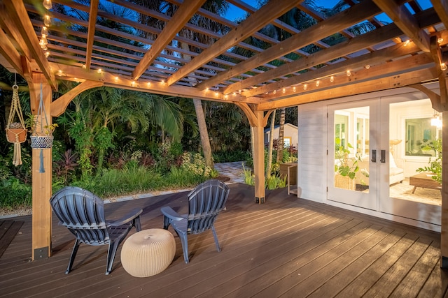 wooden terrace with french doors and a pergola