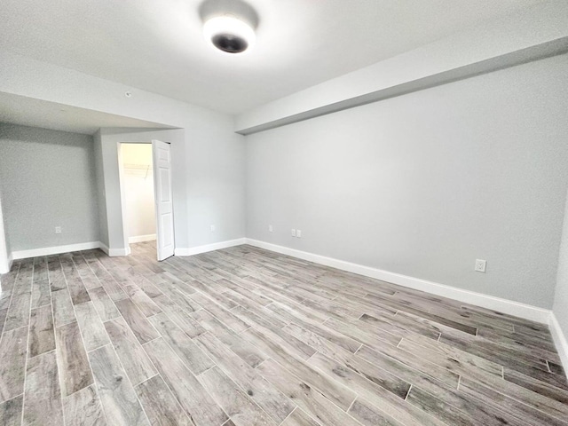 unfurnished room featuring light wood-type flooring