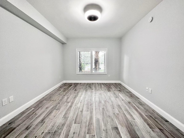 spare room with hardwood / wood-style floors