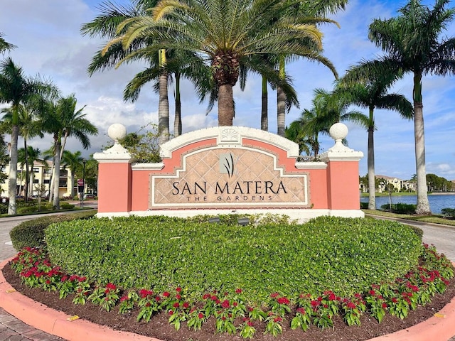 community sign with a water view