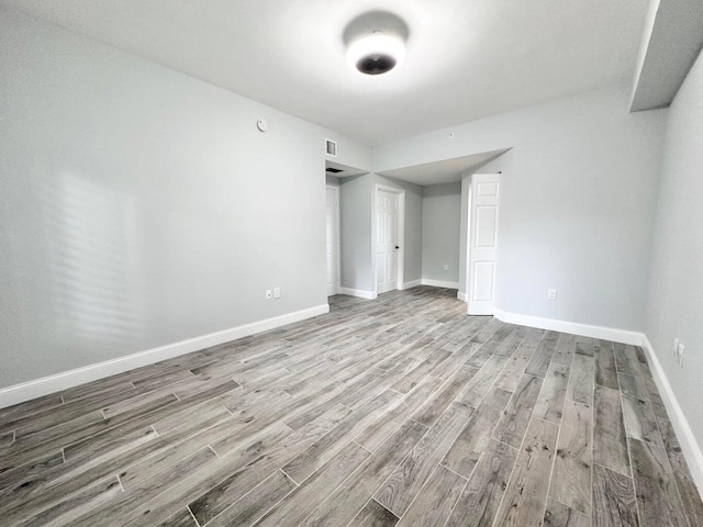 unfurnished bedroom featuring light wood-type flooring