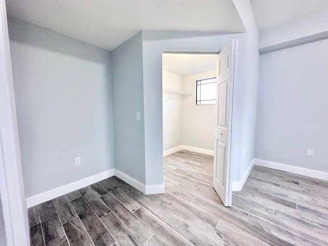 unfurnished bedroom with a closet