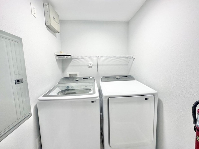 laundry area with separate washer and dryer