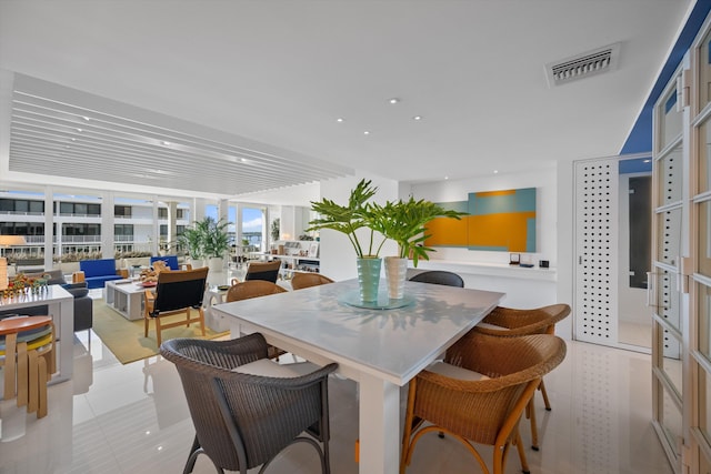 dining space with recessed lighting and visible vents