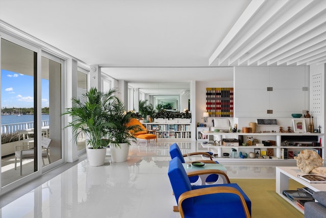 sunroom / solarium with a water view