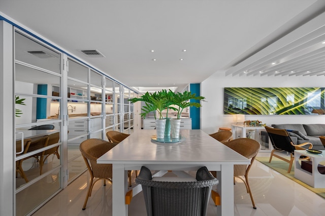 dining space with light tile patterned floors