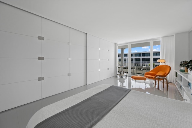 bedroom featuring floor to ceiling windows