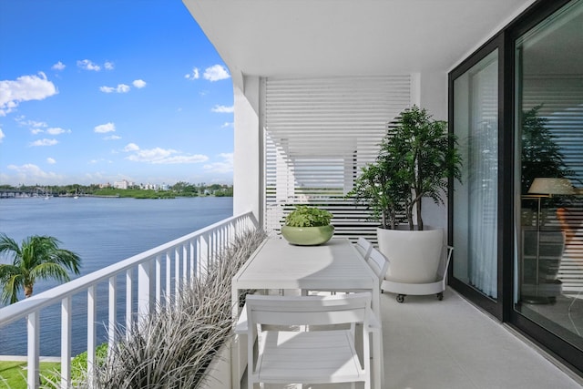 balcony featuring a water view