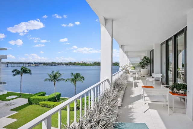 balcony featuring a water view