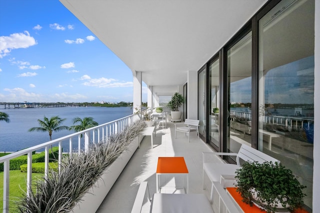 balcony featuring a water view