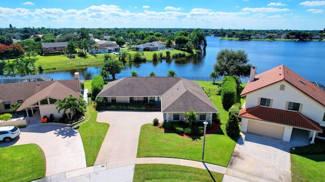 bird's eye view featuring a water view and a residential view