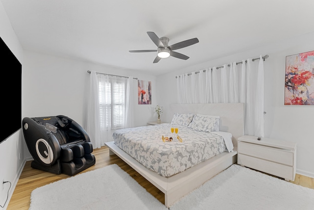 bedroom featuring ceiling fan and light hardwood / wood-style flooring