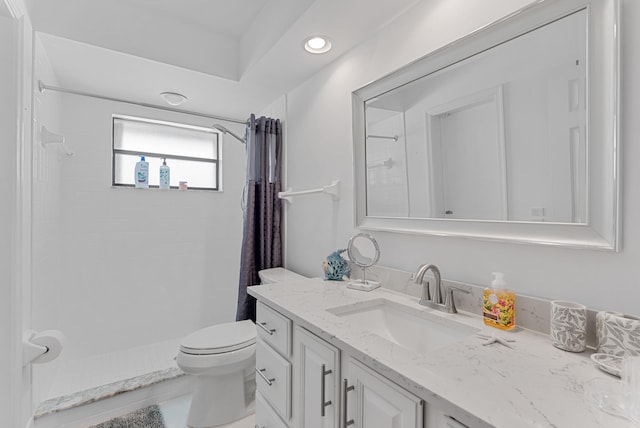 bathroom featuring tile patterned floors, a shower with shower curtain, vanity, and toilet