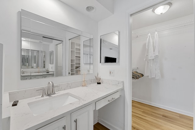 bathroom featuring hardwood / wood-style floors and vanity