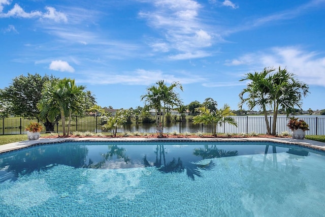 view of pool featuring a water view