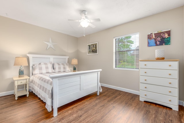 bedroom featuring ceiling fan and dark wood-type flooring