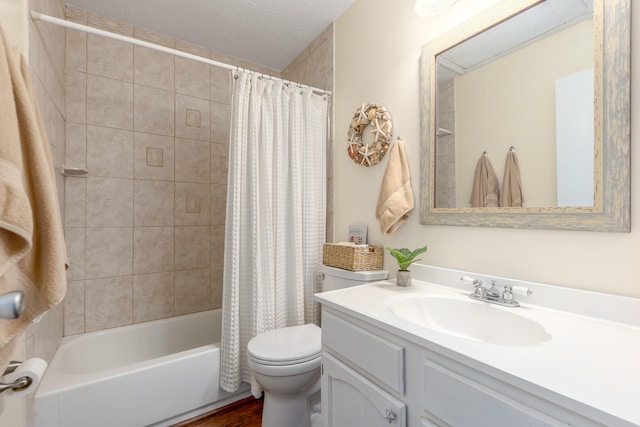 full bathroom featuring vanity, hardwood / wood-style flooring, shower / bath combo, toilet, and a textured ceiling