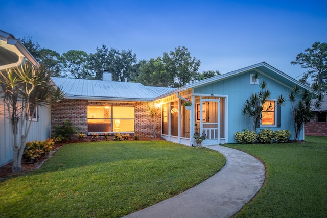 view of front of home featuring a yard