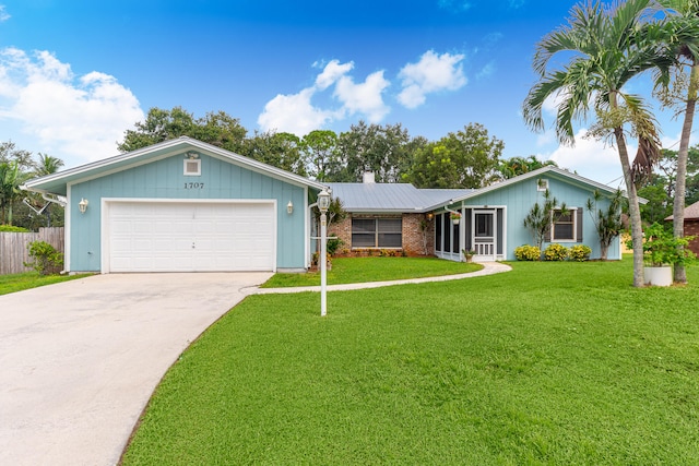 ranch-style home with a garage and a front lawn