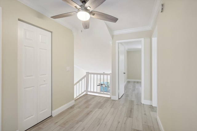 hall featuring crown molding and light wood-type flooring