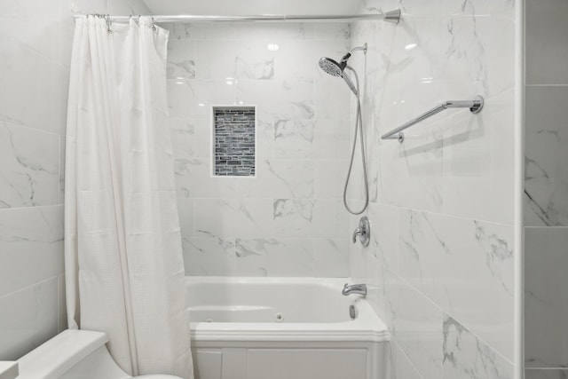 bathroom featuring toilet and shower / tub combo