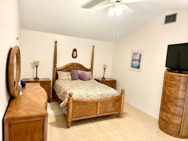 tiled bedroom with vaulted ceiling and ceiling fan