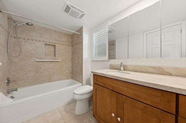 full bathroom featuring toilet, tiled shower / bath, vanity, and tile patterned floors