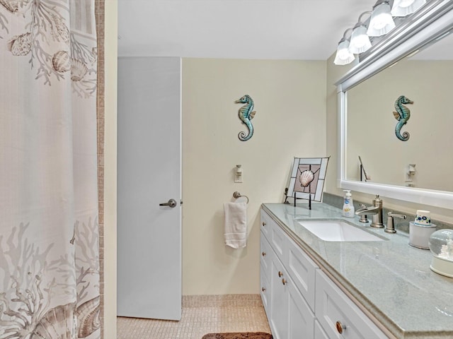 bathroom with tile patterned flooring and vanity