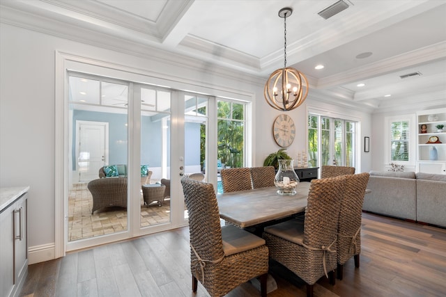 dining area featuring crown molding, coffered ceiling, dark wood-type flooring, beam ceiling, and a chandelier