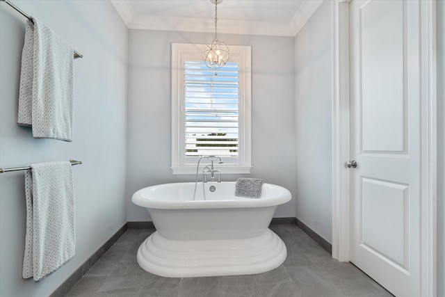 bathroom featuring a bathing tub, a notable chandelier, and ornamental molding