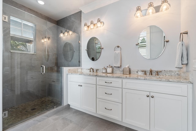 bathroom with vanity, walk in shower, and a wealth of natural light