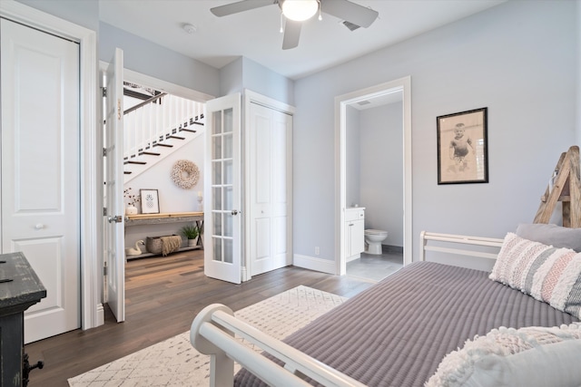 bedroom featuring connected bathroom, ceiling fan, and dark hardwood / wood-style flooring