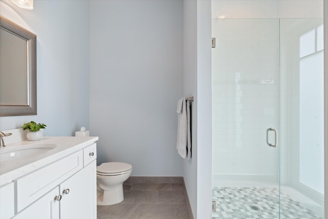 bathroom featuring vanity, an enclosed shower, toilet, and tile patterned floors