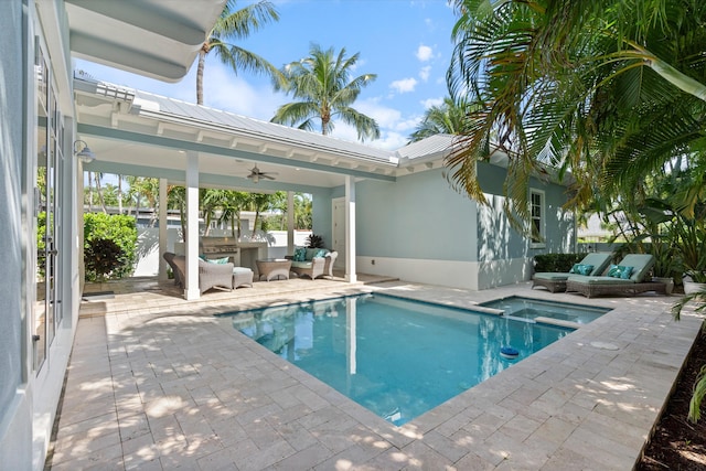 view of pool with a patio, an in ground hot tub, an outdoor hangout area, and ceiling fan