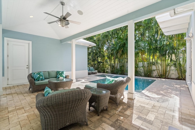 view of patio / terrace with ceiling fan, a swimming pool with hot tub, and outdoor lounge area