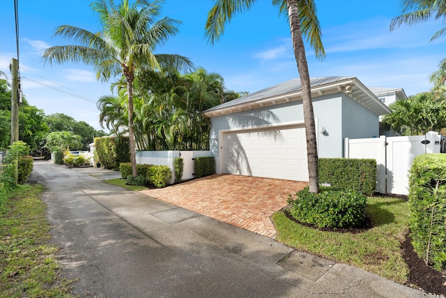 view of side of property featuring a garage