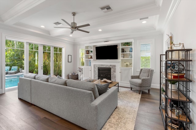 living room featuring crown molding and hardwood / wood-style flooring