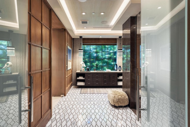 bathroom featuring vanity, an enclosed shower, and a raised ceiling