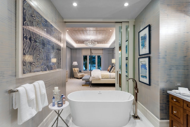 bathroom with vanity and a bathtub