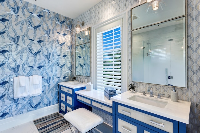 bathroom featuring vanity and a shower with shower door