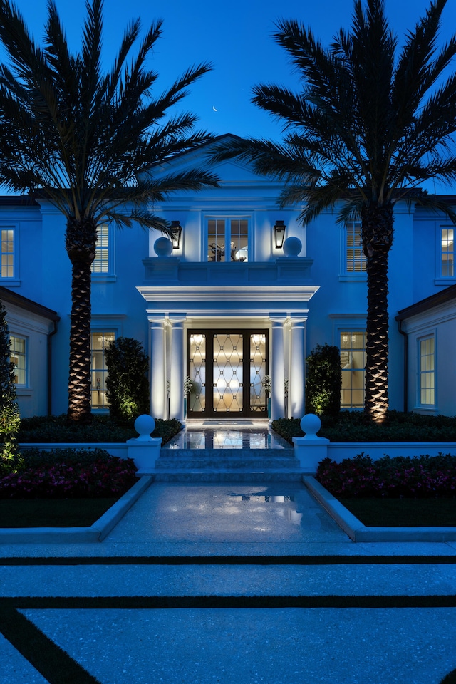 view of exterior entry featuring french doors