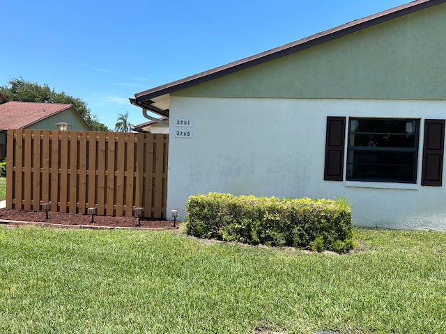 view of home's exterior featuring a lawn