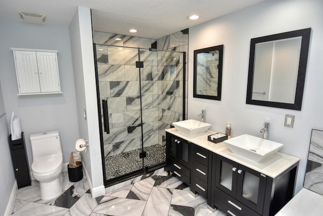 bathroom featuring toilet, an enclosed shower, and vanity