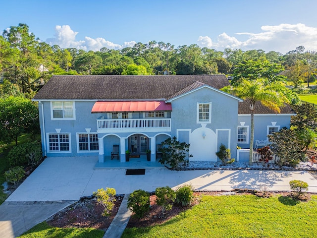 rear view of property with a patio area