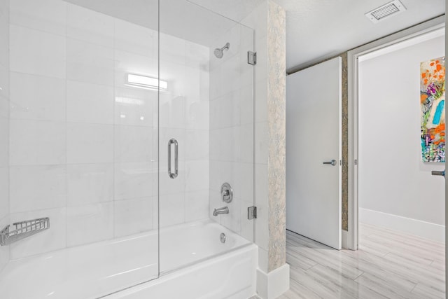 bathroom featuring enclosed tub / shower combo