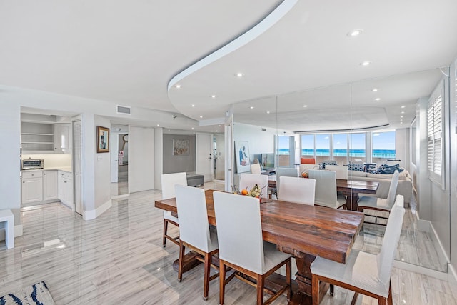 dining room featuring a wall of windows