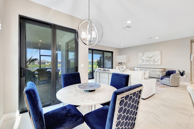 dining space with a notable chandelier and plenty of natural light