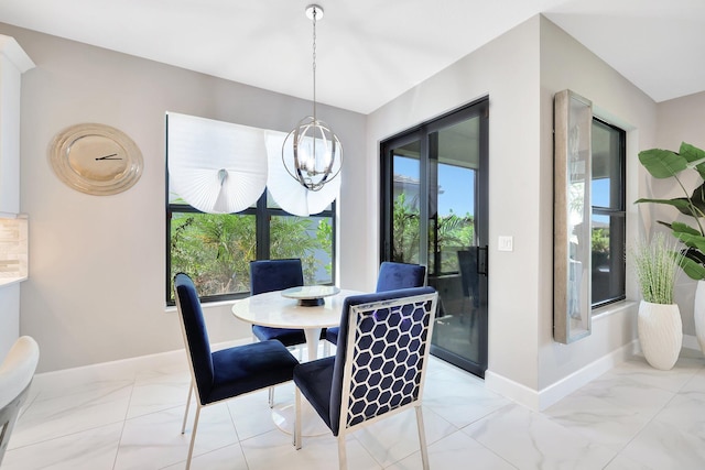 dining area featuring an inviting chandelier